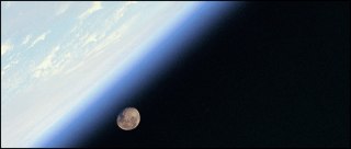 A shuttle astronaut’s view of Earth with the Moon in the distance. (NASA) 